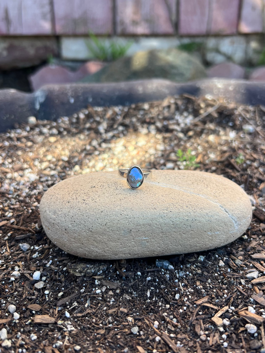 Dainty Iridescent Baroque Pearl Ring  on rock