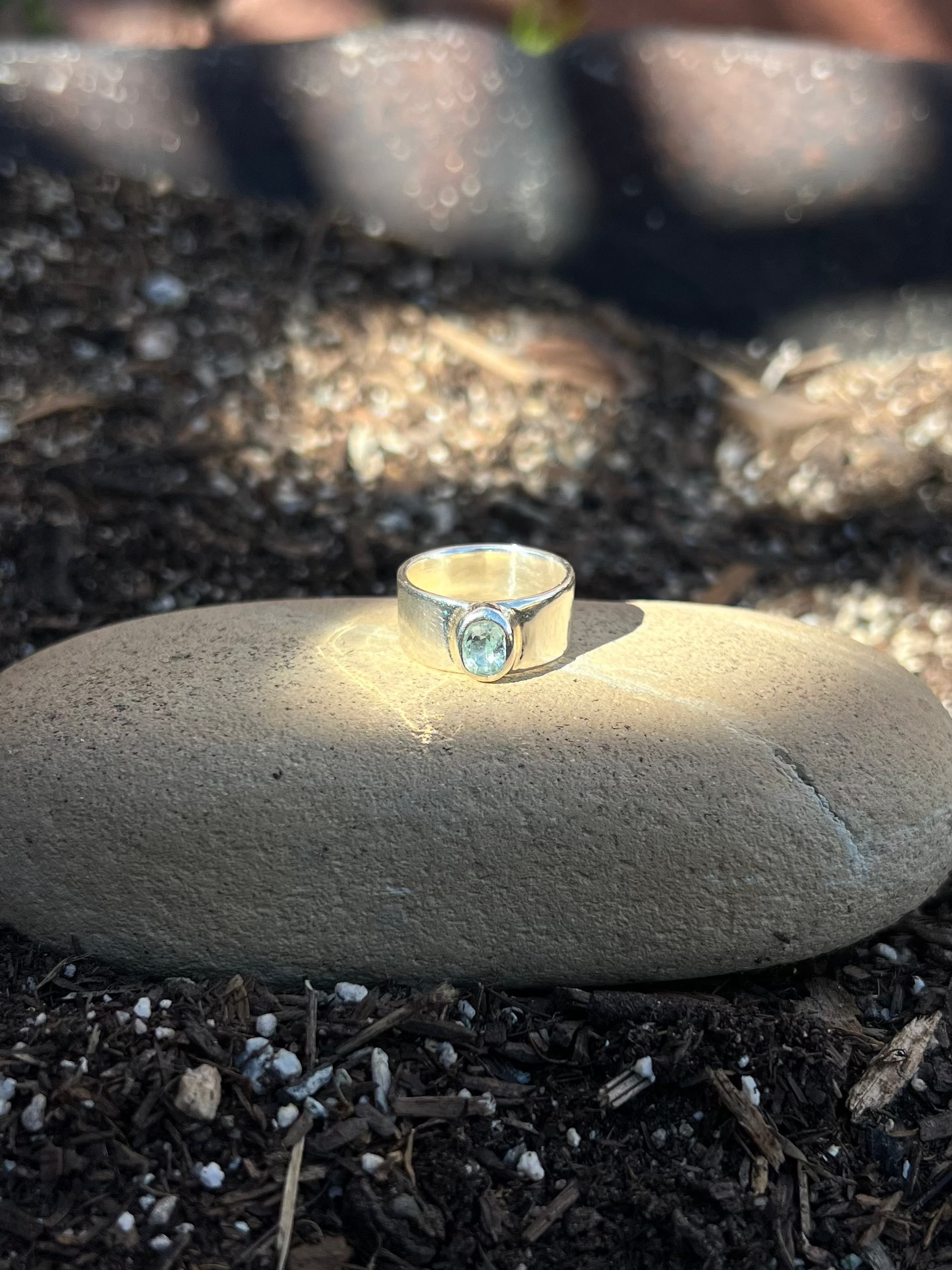 Ring on a stone in a garden setting