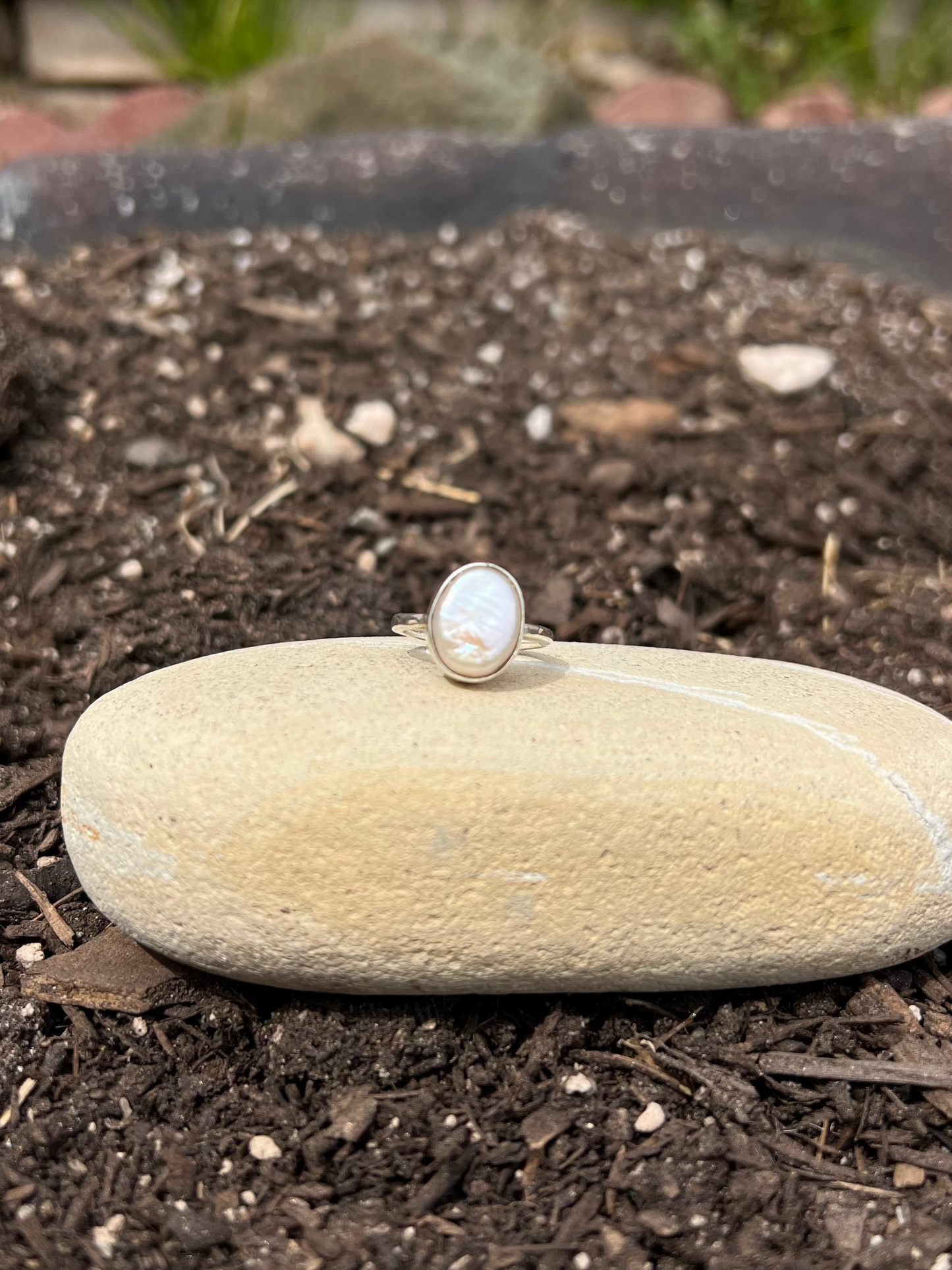Ring on a stone in a garden setting