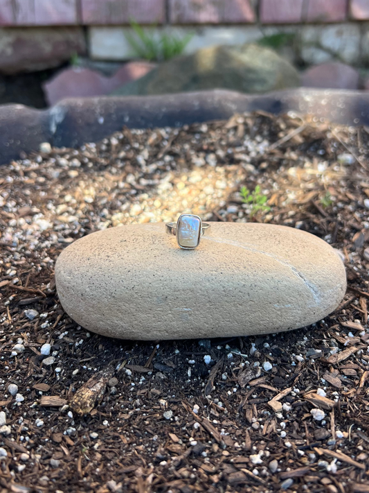 dainty square pearl ring on a rock
