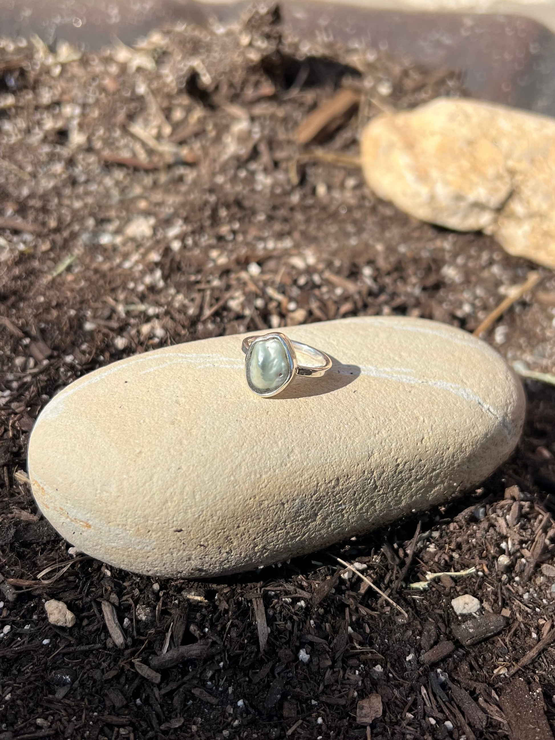 Ring on a stone in a garden setting