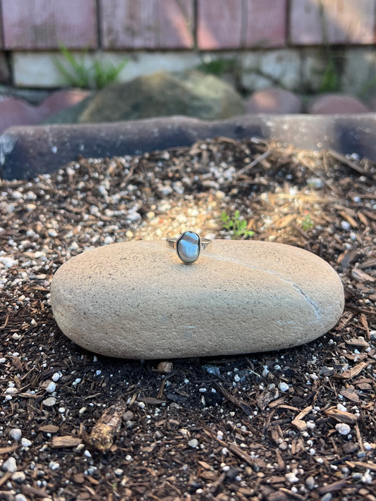 mint green baroque pearl ring on a rock