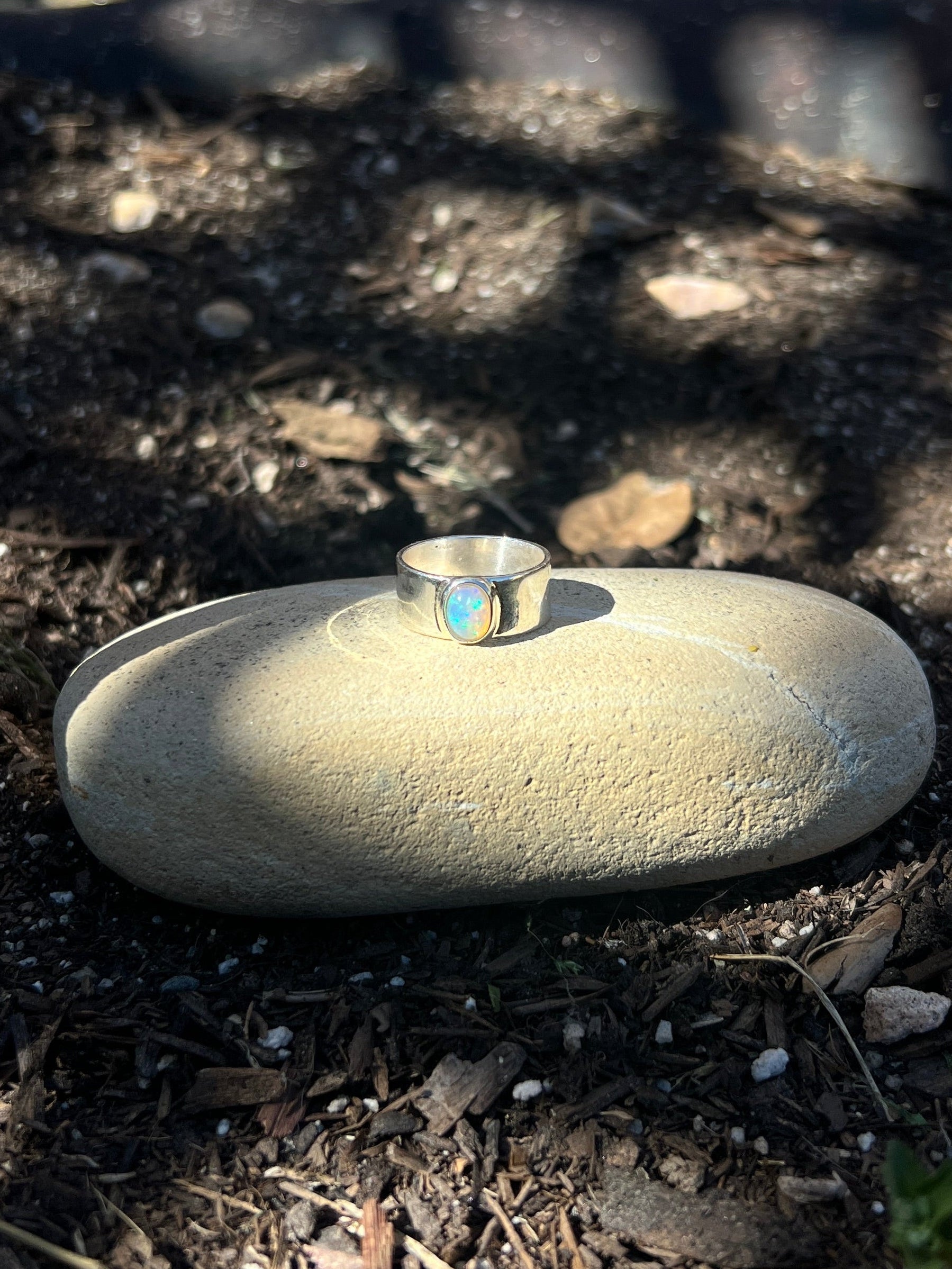 oval stone ring embedded in it on a garden bed