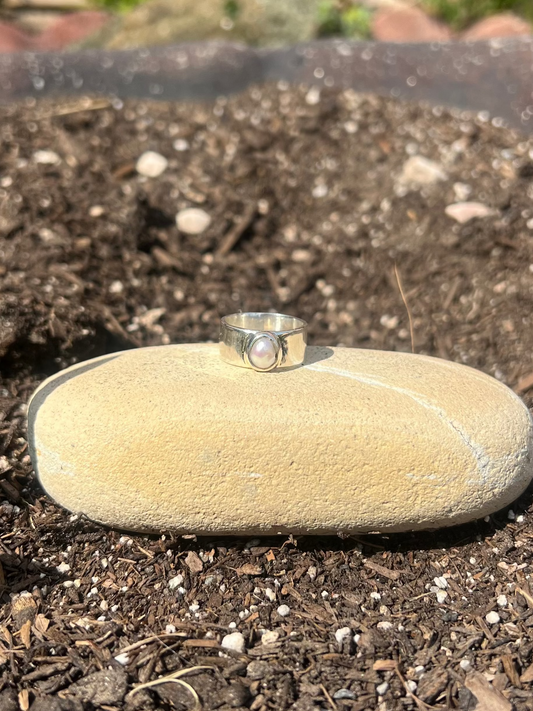 Ring on a stone in a garden setting