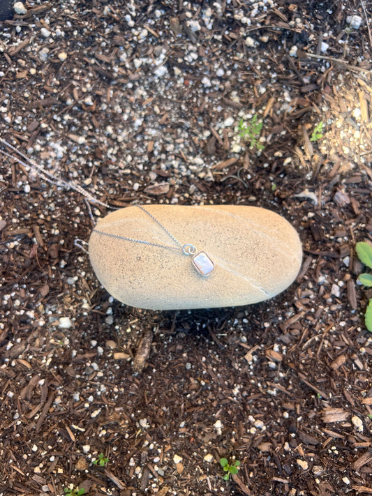 square pearl sterling silver necklace on a rock