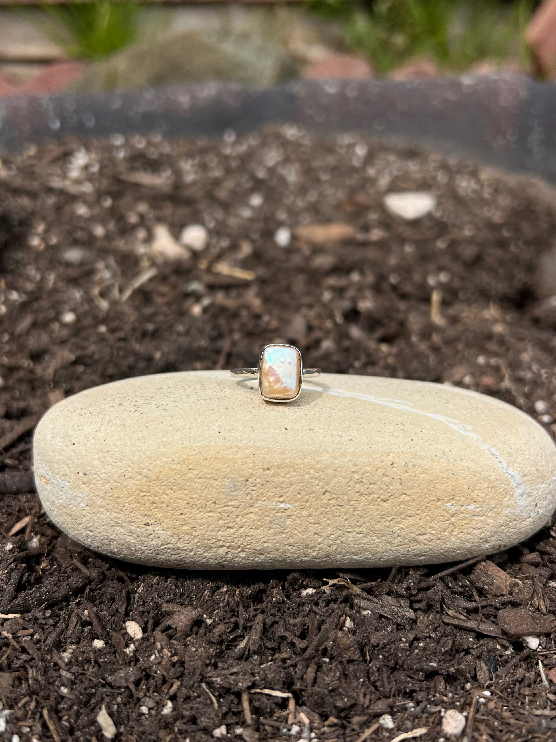 Ring on a stone in a garden setting