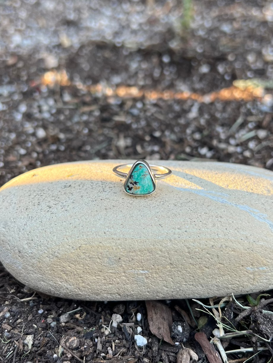 turquoise Ring on a stone in a garden setting
